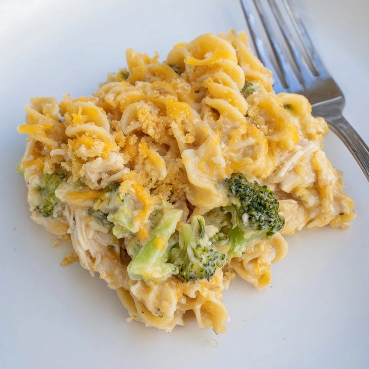 Creamy Broccoli Cheddar Chicken Noodle Casserole, a cheesy and comforting family dinner recipe.