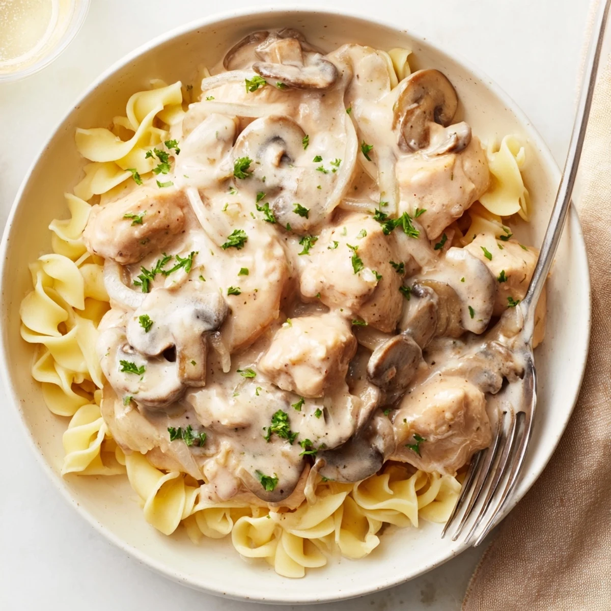 Hearty Creamy Chicken Stroganoff with golden chicken strips in a luscious sauce.