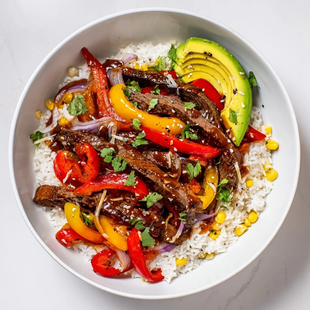Juicy BBQ Steak Fajita Bowls with colorful peppers and onions, a flavorful Tex-Mex delight.