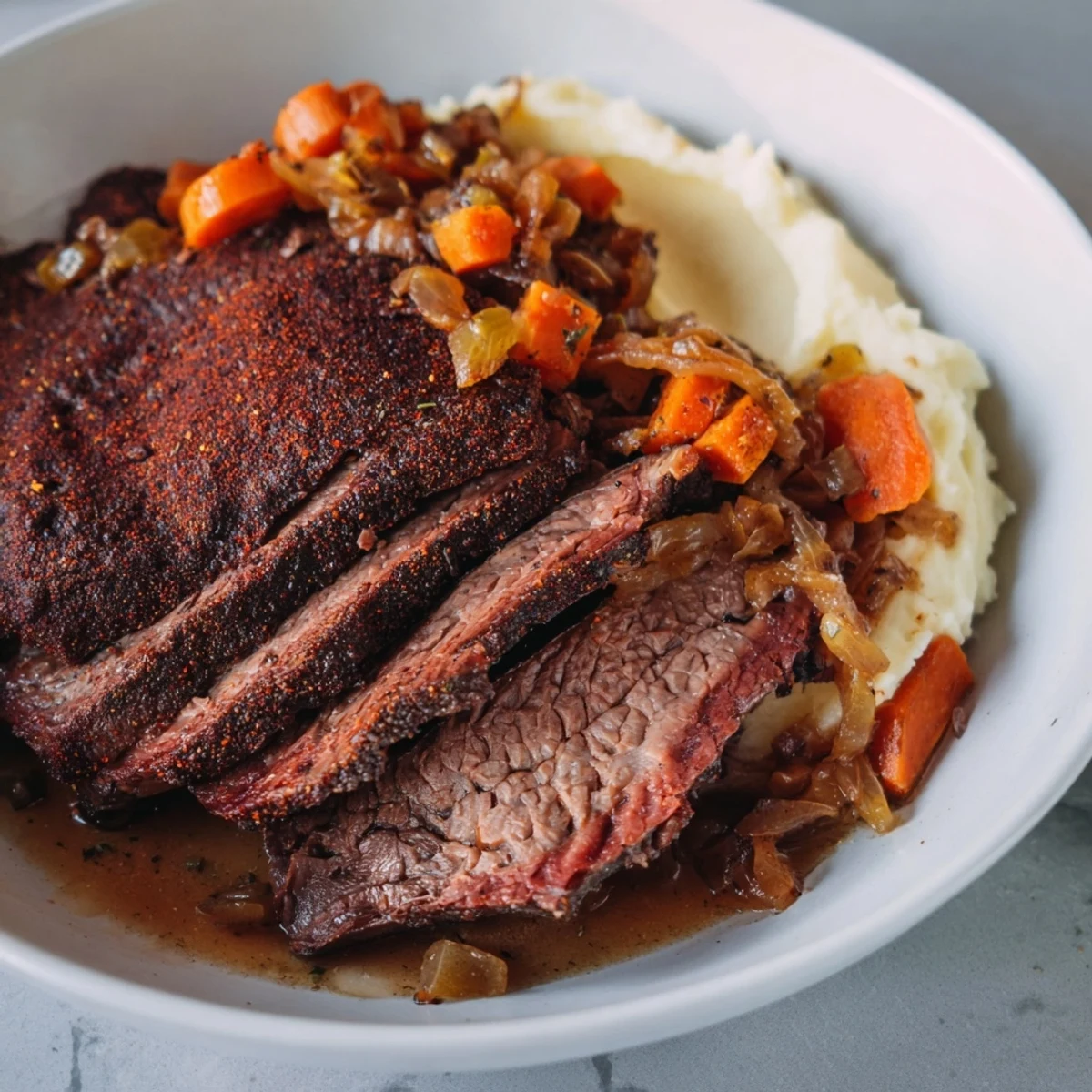 Image showing juicy classic brisket nestled beside fluffy sweet potatoes, perfect comfort food.