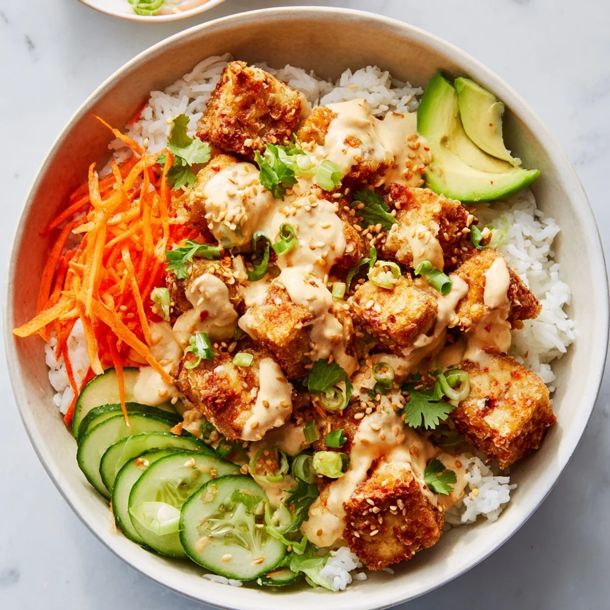 Golden-brown chili-mayo baked tofu bowls, a delicious vegetarian dinner with colorful fresh toppings.