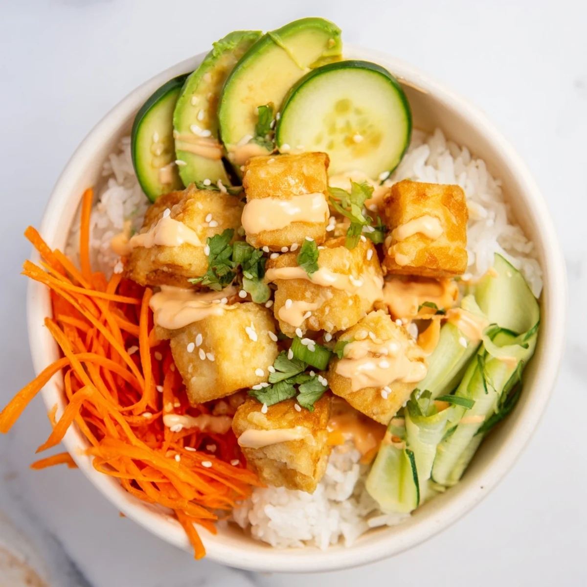Imagine the texture: crispy chili-mayo baked tofu nestled on rice, a visually appealing complete meal.