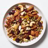Up close, a hearty serving of Nutty Nosh Squirrel Snack Mix shows the perfectly toasted nuts and seeds.
