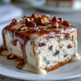 Bite-sized carrot cake truffles enrobed in smooth cream cheese coating, garnished with nuts and sprinkles.  