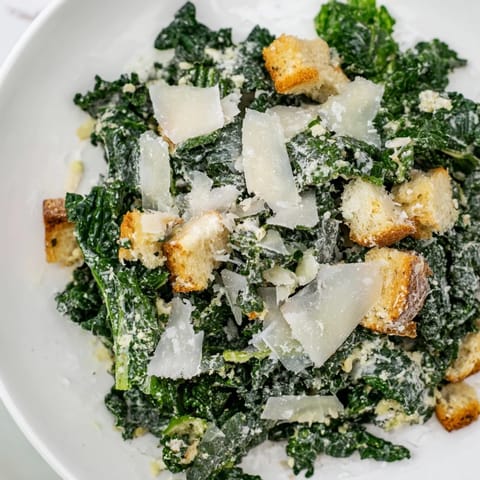 Creamy homemade Caesar dressing coats fresh kale in this flavorful Kale Caesar Salad recipe.