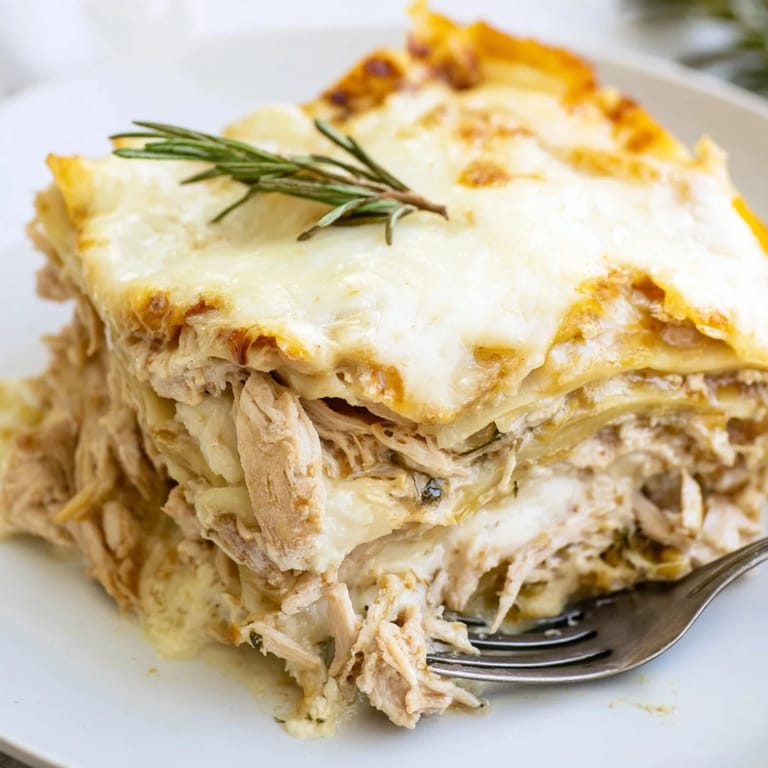 Savor the delightful flavors of rosemary chicken lasagna, bubbling with cheese and béchamel.  